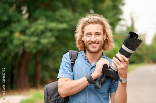 Young male photographer wit...