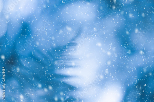 Abstract blurred blue background for Christmas or winter concept. Silhouette ...