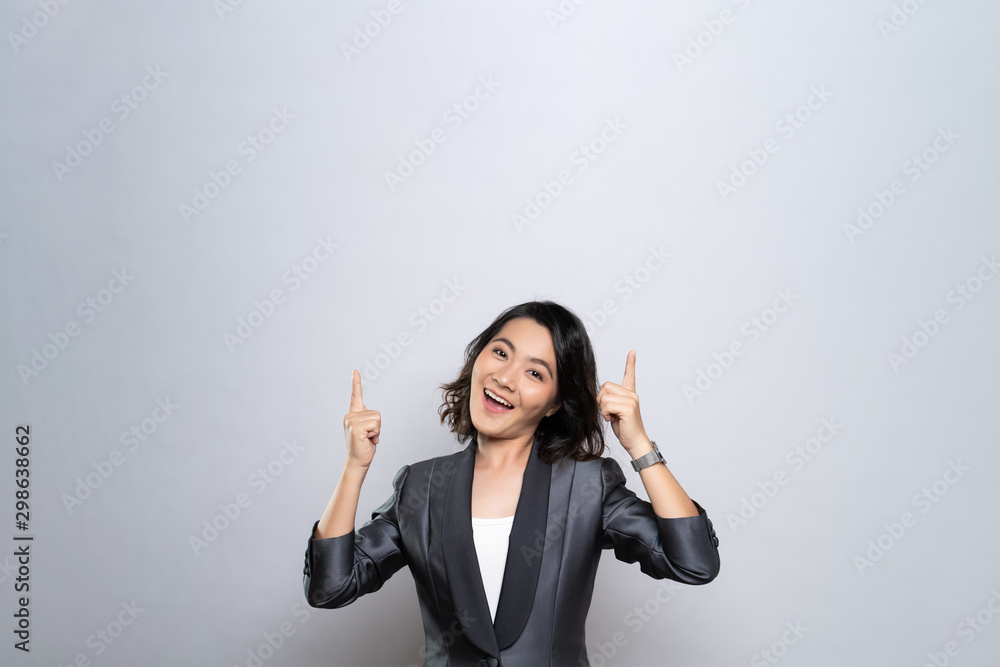 Happy woman present the copy space isolated over white background