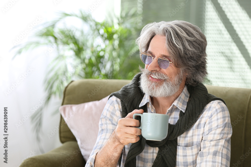 Portrait of handsome senior man drinking tea at home Portrait of handsome senior man drinking tea at home
