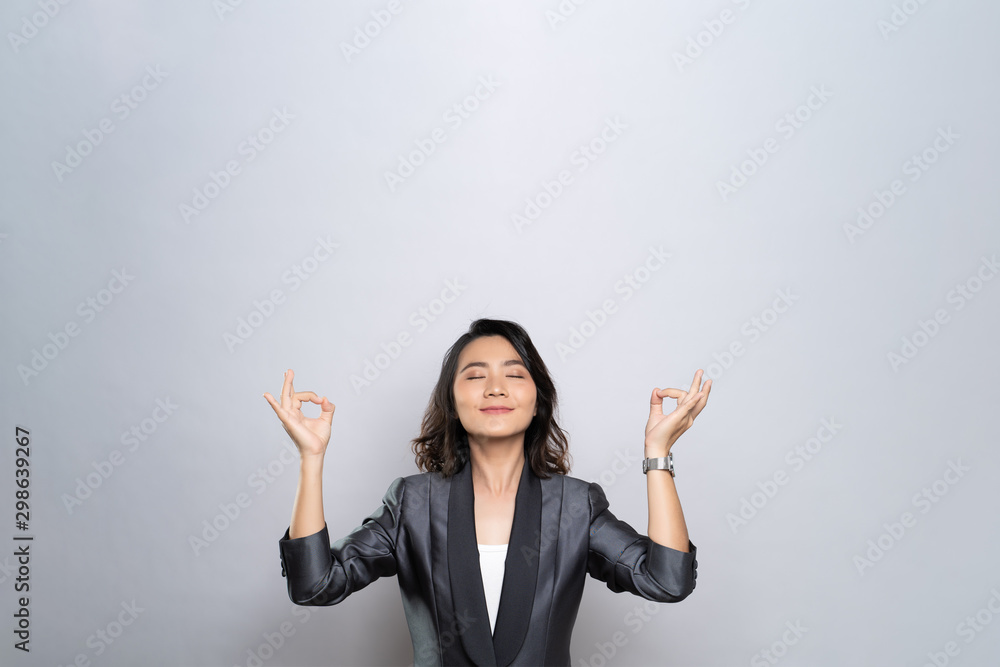 Woman meditating holding her hands in yoga gesture isolated on white background Woman meditating holding her hands in yoga gesture isolated on white background