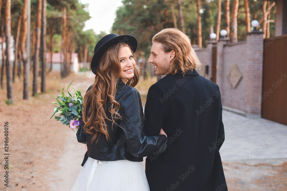 Fototapeta premium Happy couple celebrating their wedding outdoors