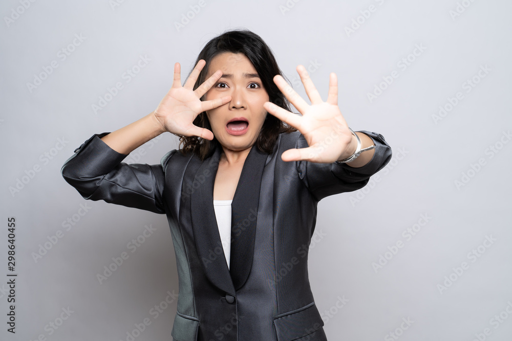 Woman feel scared standing isolated over white background Woman feel scared standing isolated over white background