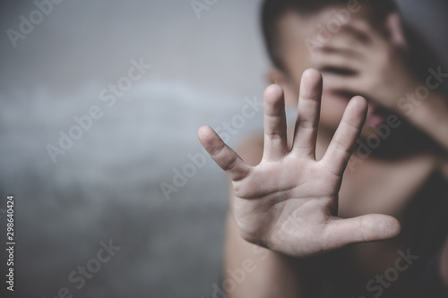 Boy showing hand signaling to stop useful to campaign against violence and pain. Stop abusing boy violence.  Human Rights Day concept.