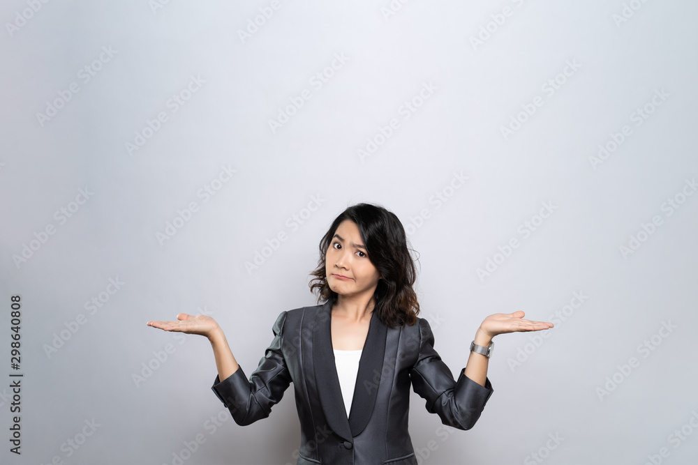 Portrait of a confused woman isolated over white background Portrait of a confused woman isolated over white background