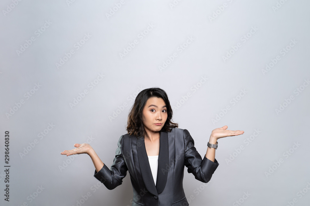 Portrait of a confused woman isolated over white background Portrait of a confused woman isolated over white background