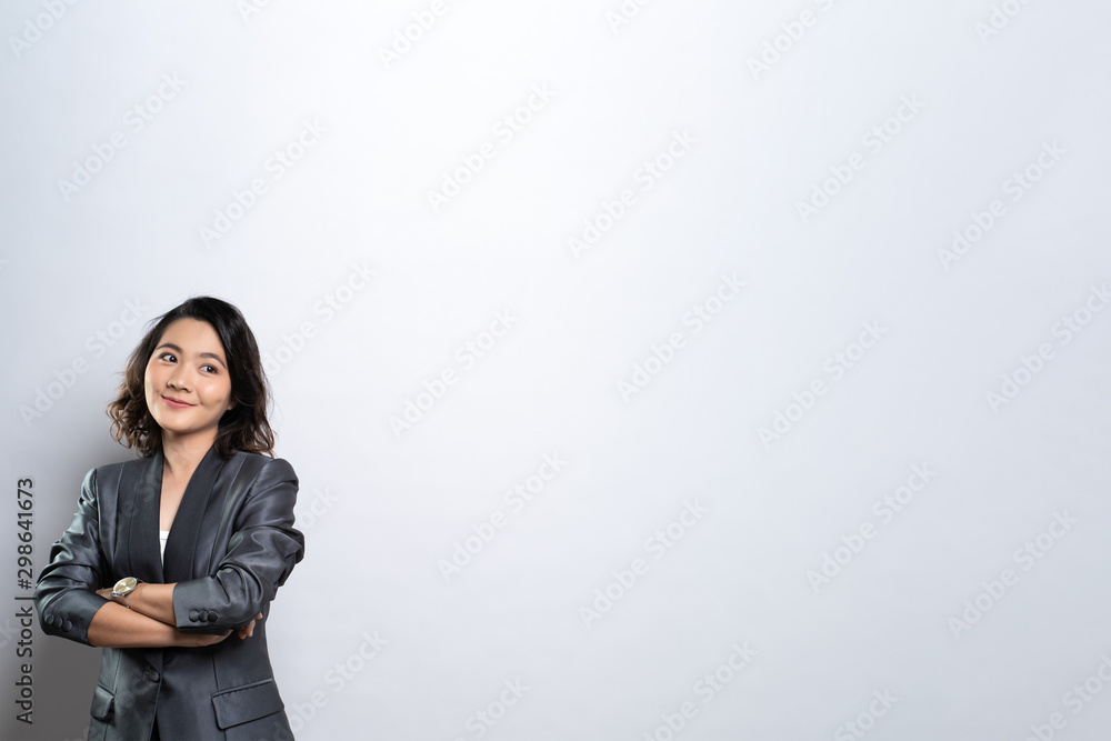 Happy woman thinking and standing isolated over white background Happy woman thinking and standing isolated over white background
