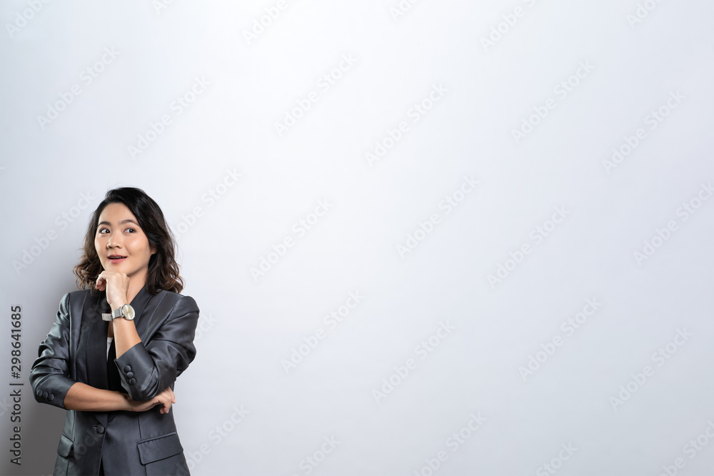 Happy woman thinking and standing isolated over white background Happy woman thinking and standing isolated over white background