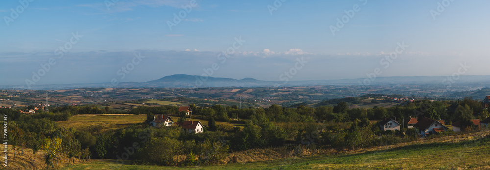 Early morning above hills and distant mountain Bukulja in Serbia rural landscape region