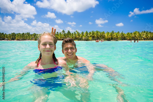 Caucasian teenagers swimmin...