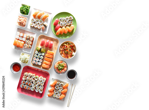 Assortment of trays and plate of sushi and maki