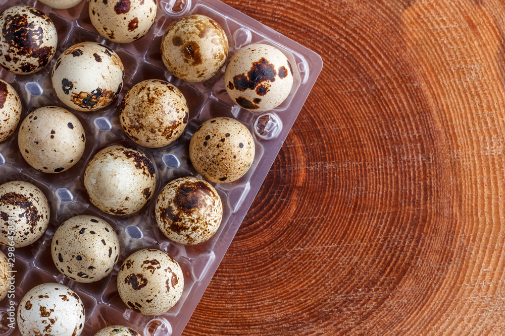 small motley quail eggs in transparent plastic packages.Open space, healthy food concept, plants, soil, organic natural products, natural food, vegetarian dishes, vegetables, raw small motley quail eggs in transparent plastic packages.Open space, healthy food concept, plants, soil, organic natural products, natural food, vegetarian dishes, vegetables, raw