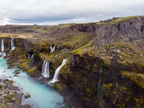 Scenic landscape view of incredible Sigoldugljufur canyon in highlands with turquoise river  Iceland. Volcanic landscape on background. Popular tourist attraction..