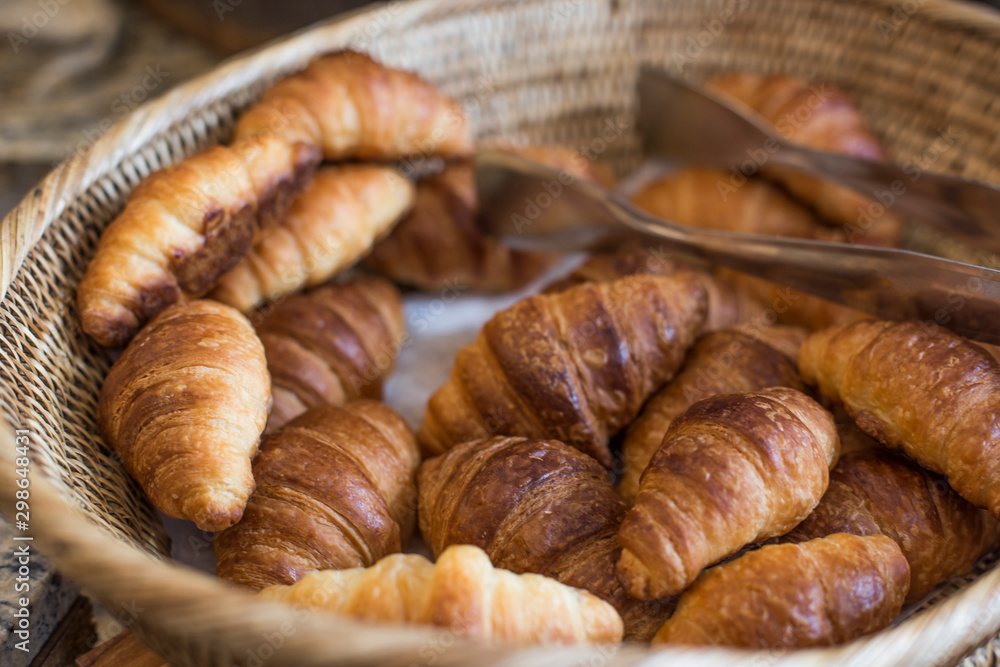 delicious fresh croissants in basket. delicious fresh croissants in basket.