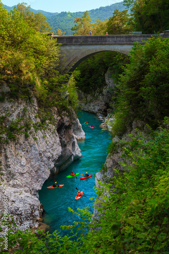 Kayakers on the turquoise Soca river, near Kobarid, Slovenia
