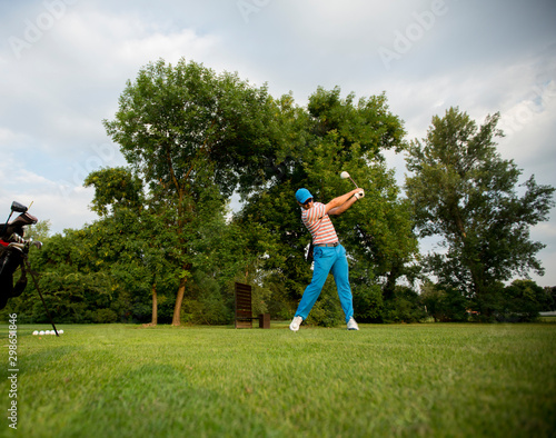 Young man playing golf
