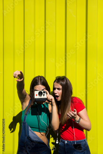 Two pretty young happy wome...