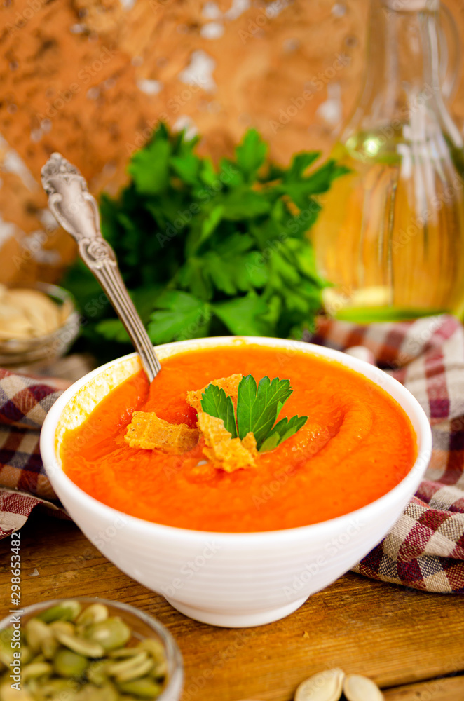 Appetizing orange pumpkin cream soup. Lunch for Halloween. Appetizing orange pumpkin cream soup. Lunch for Halloween.
