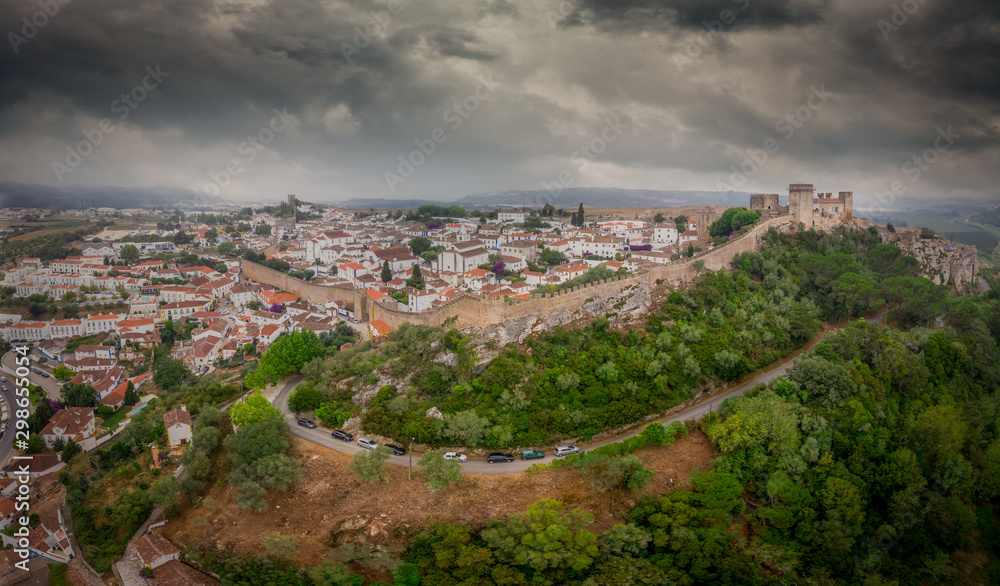 Aerial view of Obidos castle and walled medieval town in Central Portugal one of the seven wonders of Portugal with a pousada luxury hotel popular tourist destination