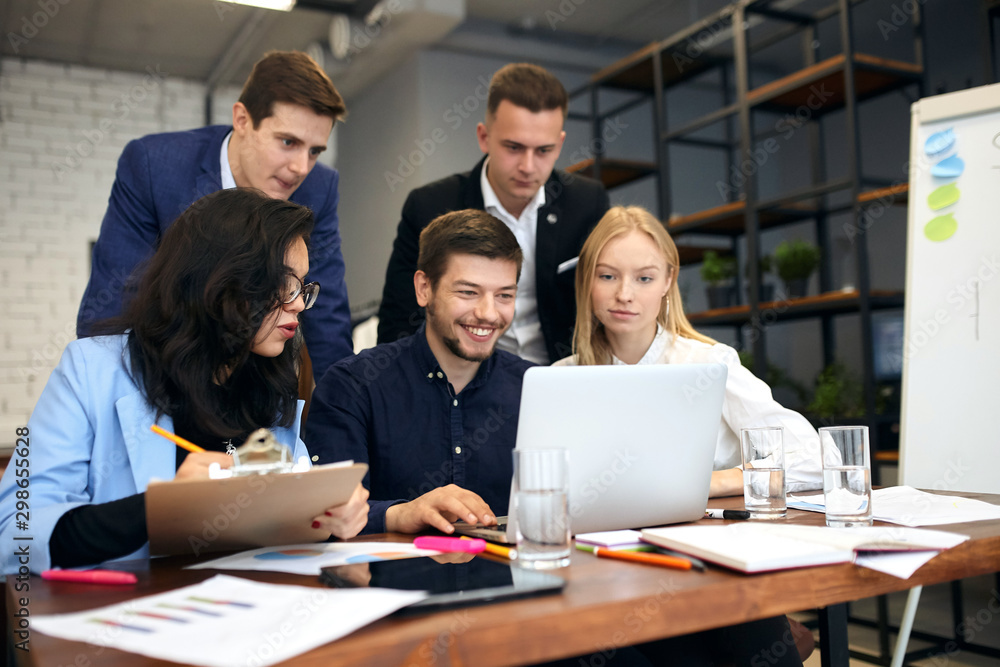 cheerful smiling business people making up a project, creative ideas, plans for prosperous business. lifestyle, occupation, job, profession cheerful smiling business people making up a project, creative ideas, plans for prosperous business. lifestyle, occupation, job, profession