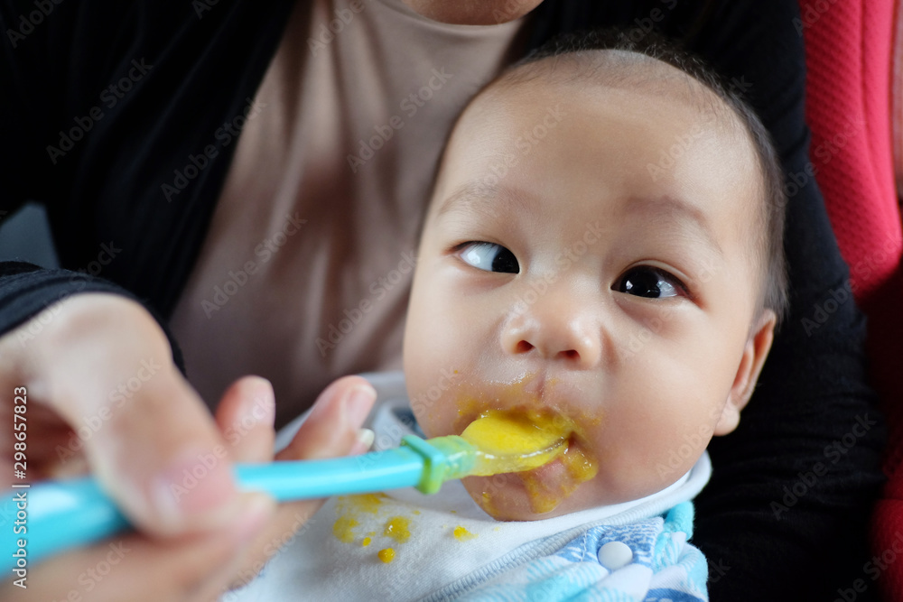 Asian boy with strabismus and eating food. Asian boy with strabismus and eating food.