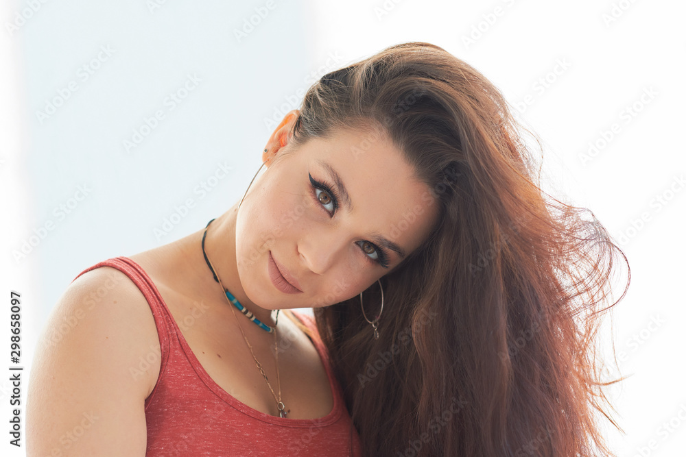 portrait of young beautiful and happy Latin woman with big toothy smile excited and cheerful in charming face expression isolated clear grey background in female happiness emotion portrait of young beautiful and happy Latin woman with big toothy smile excited and cheerful in charming face expression isolated clear grey background in female happiness emotion