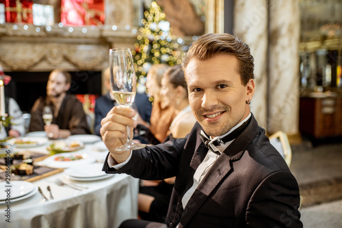 Man with friends during a festive dinner on New Years Eve