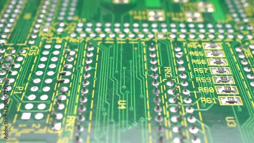 Circuit board. Printed circuit board surface, extreme close up. Electronic technology background. Dolly shot, sliding camera move and selective focus 4k footage.