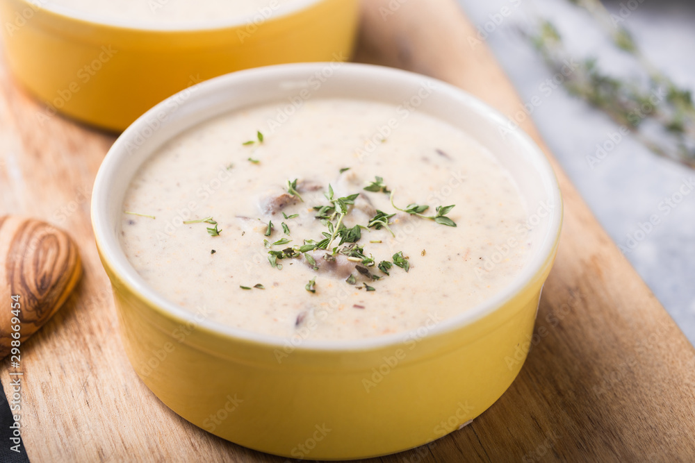 A bowl of delicious homemade cream of mushroom soup. A bowl of delicious homemade cream of mushroom soup.
