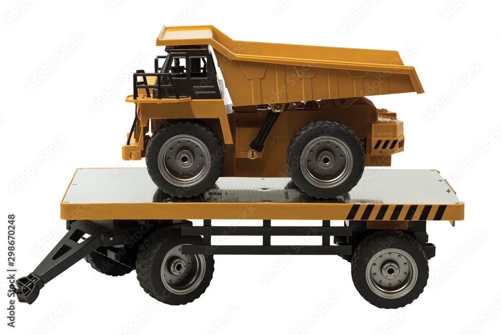 View of R/C model dump truck and trailer on a white background. Free time Children and adults concept.