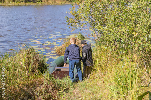 Children prepare an inflatable boat for launching