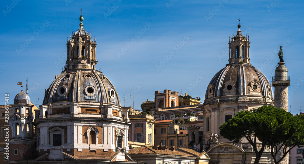 The view on dome of the Santa Maria di Loreto church and dome of the Church of the Most Holy Name of Mary at the Trajan Forum. The view from Victor Emmanuel II National Monument in Rome.