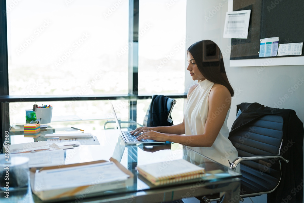 Determined Female Professional Working At Office Determined Female Professional Working At Office
