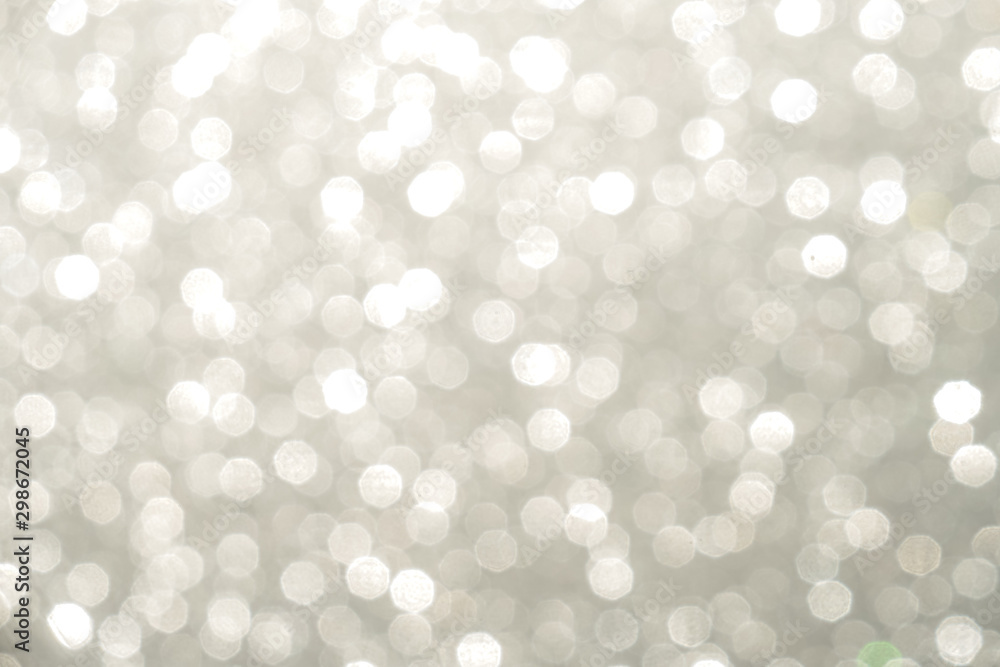 Silver Sparkling Lights Festive background with texture. Abstract Christmas twinkled bright bokeh defocused and Falling stars. Winter Card or invitation Silver Sparkling Lights Festive background with texture. Abstract Christmas twinkled bright bokeh defocused and Falling stars. Winter Card or invitation