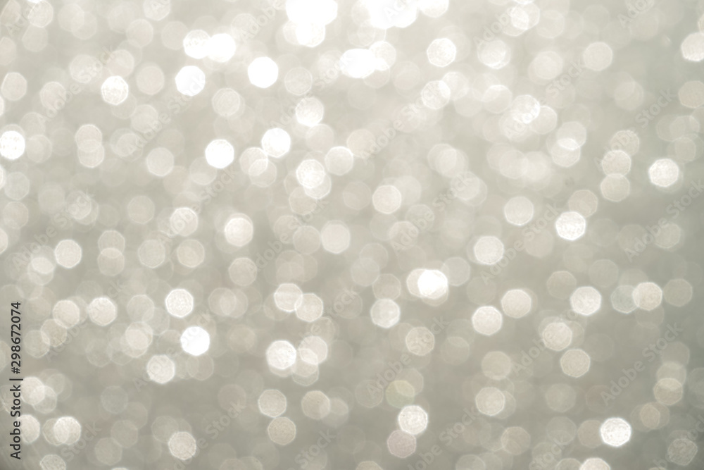 Silver Sparkling Lights Festive background with texture. Abstract Christmas twinkled bright bokeh defocused and Falling stars. Winter Card or invitation Silver Sparkling Lights Festive background with texture. Abstract Christmas twinkled bright bokeh defocused and Falling stars. Winter Card or invitation