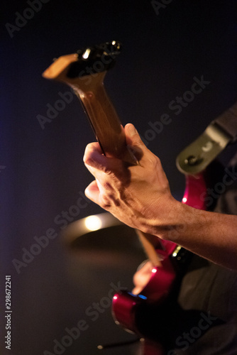 Guitarist hands playing electric guitar. Close up .