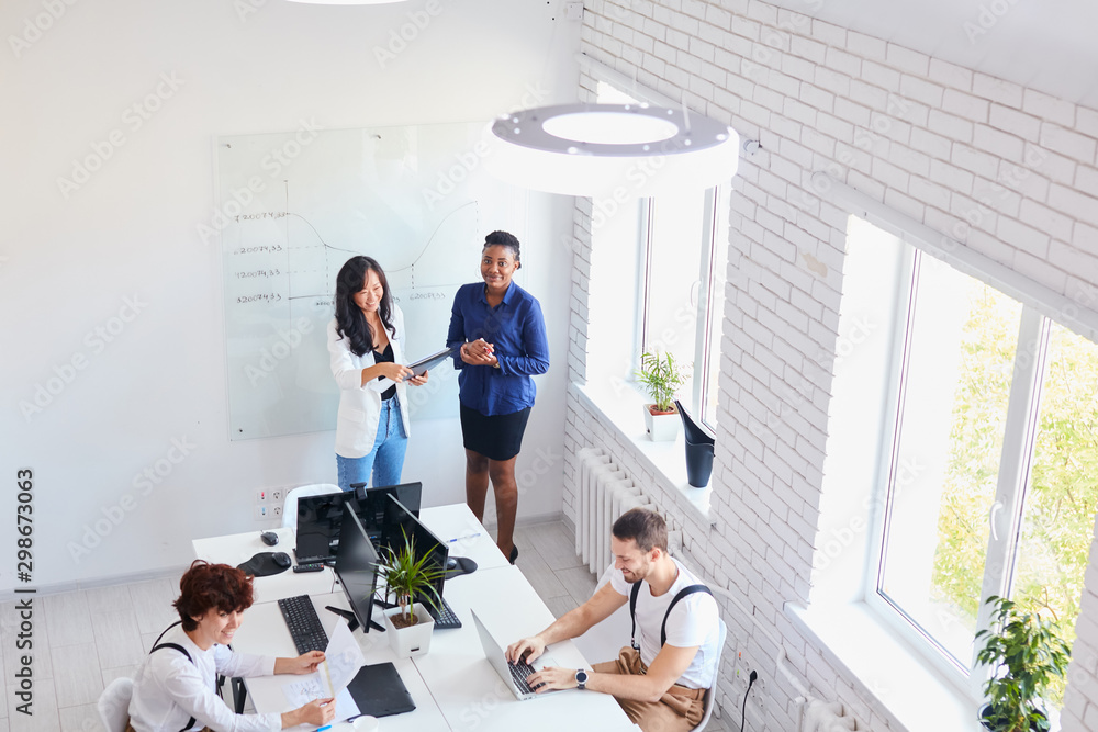 Business for people. Young staff having conversation with african coach, businesswoman, Smiling, laughing Business for people. Young staff having conversation with african coach, businesswoman, Smiling, laughing
