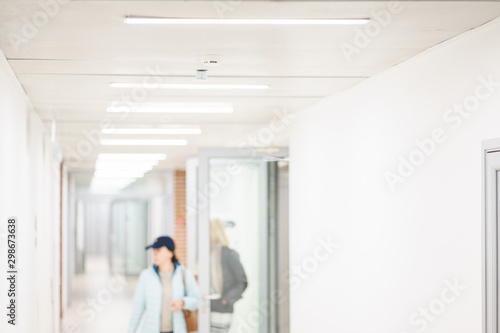 Blurred interior internal corridor modern office, industrial premises, laboratories or institutions. © Evgenii Starkov
