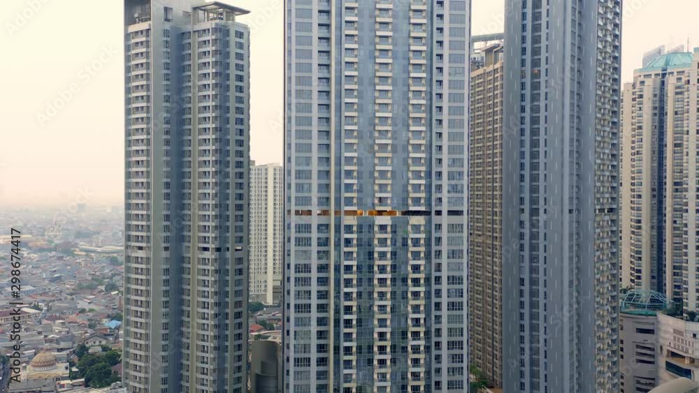 Aerial of tall skyscrapers in downtown Jakarta, Pedestal Upward Aerial of tall skyscrapers in downtown Jakarta, Pedestal Upward