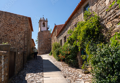 Old stone houses and narrow street in the ancient town of Castelo Rodrigo in Portugal