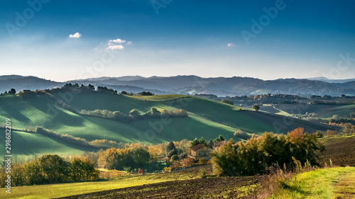 Shadows on the rolling hills between Emilia-Romagna and Marche, Italy. photo