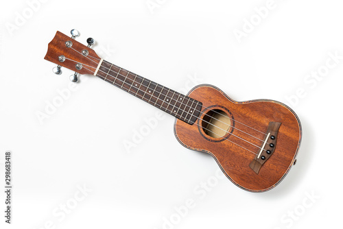 Wooden ukulele, white background. Top view.