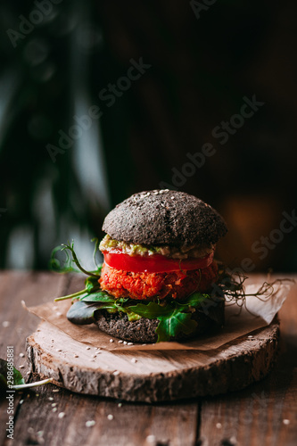 Vegetarian burger with chickpeas on a fresh homemade black bun
