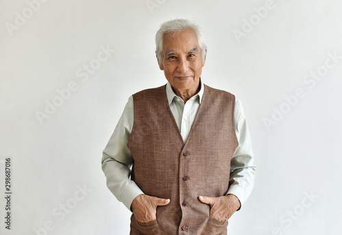 Obraz na płótnie Senior asian old man, Confident and smiling elderly people on white background, Happy retiree citizen concept. w salonie