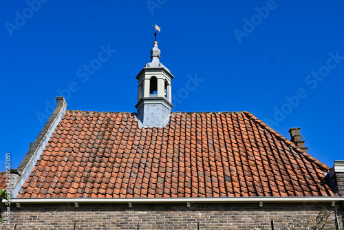 Historic Dutch Red Tile Roof Design with Gutter and Steeple Portico in Edam Netherlands