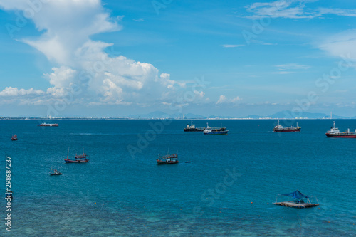 Fishing boats floating in the sea with blue sky