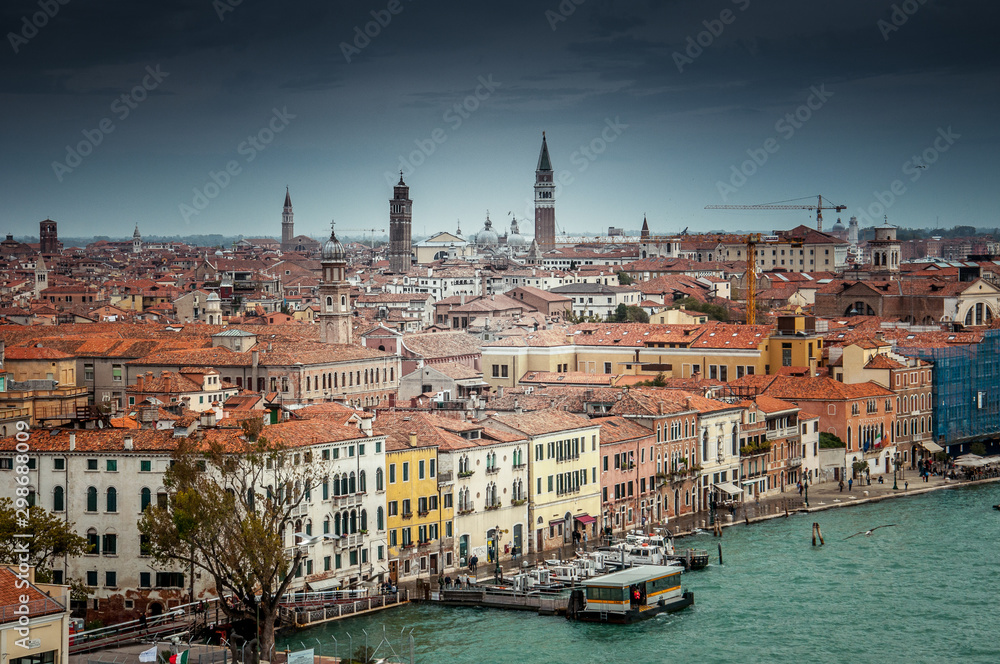 Fototapeta premium Beautiful cloudy sky over Venice aerial panorama, Italy. Concept: historic Italian places, evocative and little-known views of Venice