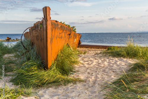 An old rusty and damaged batteship wreck on the beach. Hel, Poland