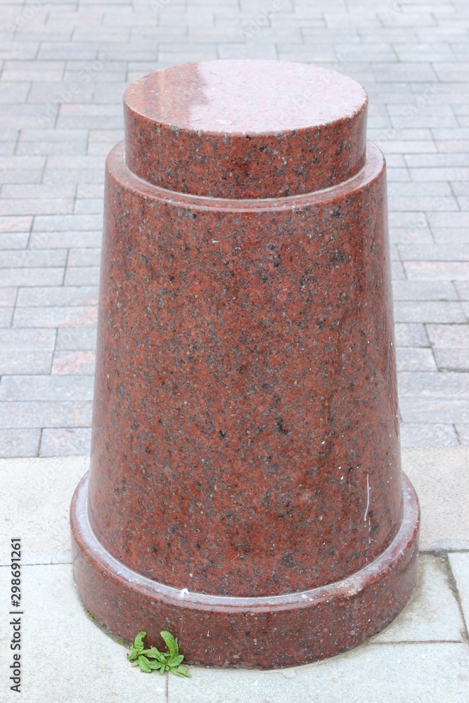 A small beautiful pillar of red granite. Moscow. Russia.