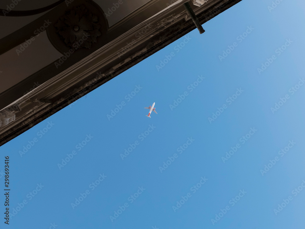 Plane at cruising altitude against blue sky Plane at cruising altitude against blue sky